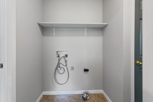 clothes washing area featuring washer hookup, electric dryer hookup, baseboards, and laundry area