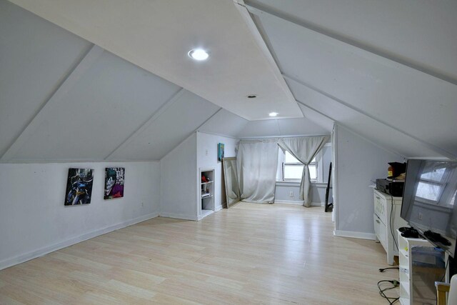 5336 W Nelson St, Chicago, IL 60641 - additional living space with light wood-type flooring, baseboards, and lofted ceiling