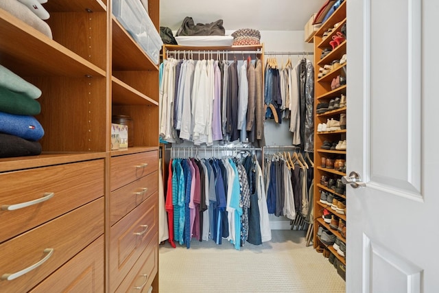 walk in closet with tile patterned flooring