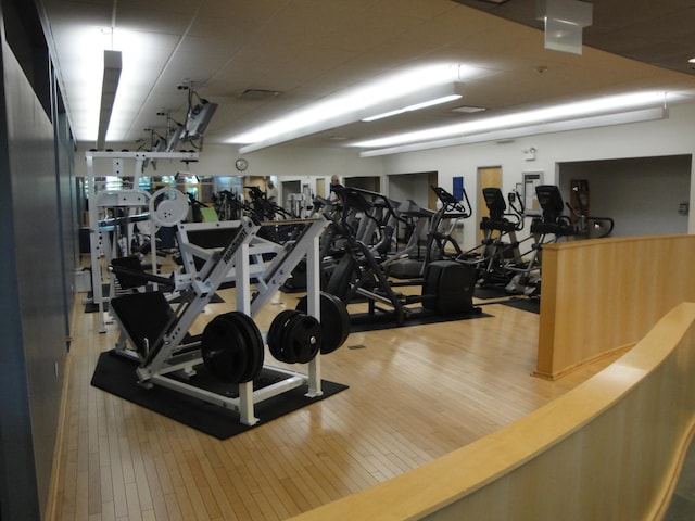 gym with wood finished floors