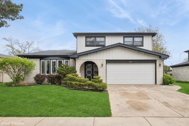 515 S Inner Circle Dr, Mount Prospect, IL 60056 - view of front of house with concrete driveway, brick siding, a front yard, and a garage