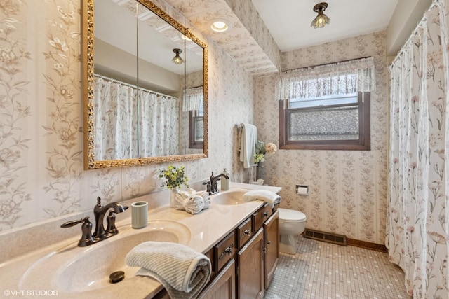 515 S Inner Circle Dr, Mount Prospect, IL 60056 - full bathroom featuring visible vents, tile patterned flooring, a sink, toilet, and wallpapered walls