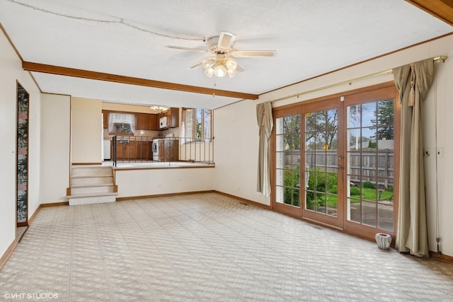 515 S Inner Circle Dr, Mount Prospect, IL 60056 - unfurnished living room featuring baseboards and a wealth of natural light
