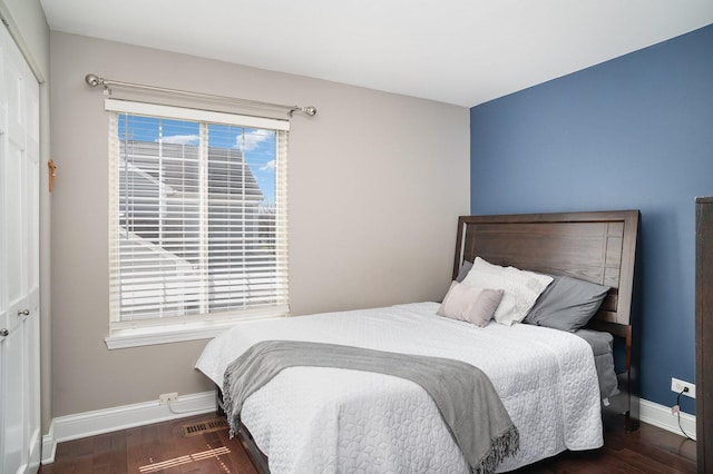 553 Ivory Ln, Bartlett, IL 60103 - bedroom with baseboards, multiple windows, and wood finished floors