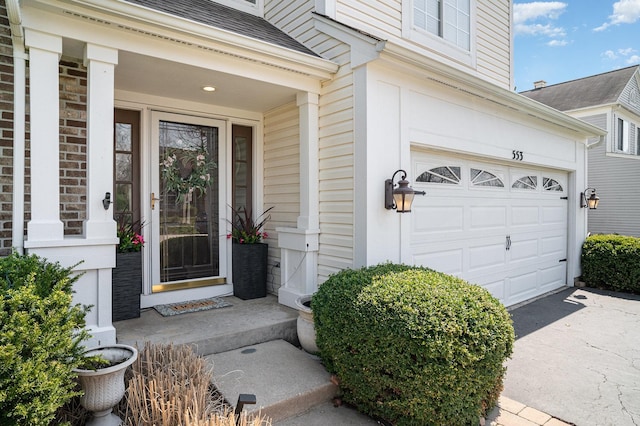 553 Ivory Ln, Bartlett, IL 60103 - doorway to property with an attached garage, driveway, and a shingled roof