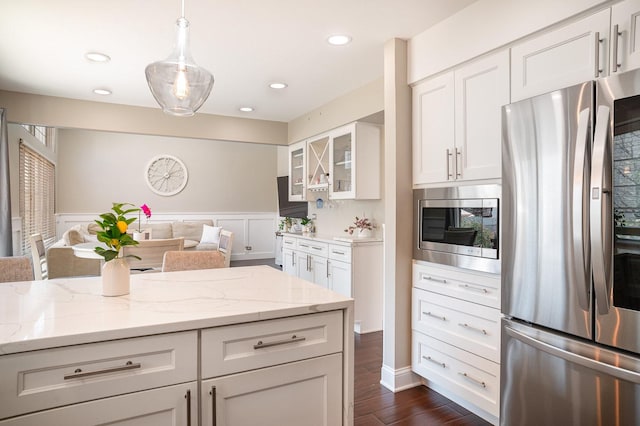 553 Ivory Ln, Bartlett, IL 60103 - kitchen featuring light stone countertops, glass insert cabinets, open floor plan, white cabinets, and stainless steel appliances