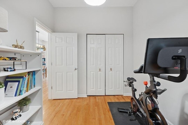 exercise room with wood finished floors