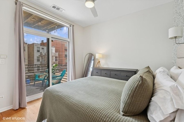 bedroom featuring access to outside, light wood-style flooring, a ceiling fan, baseboards, and visible vents