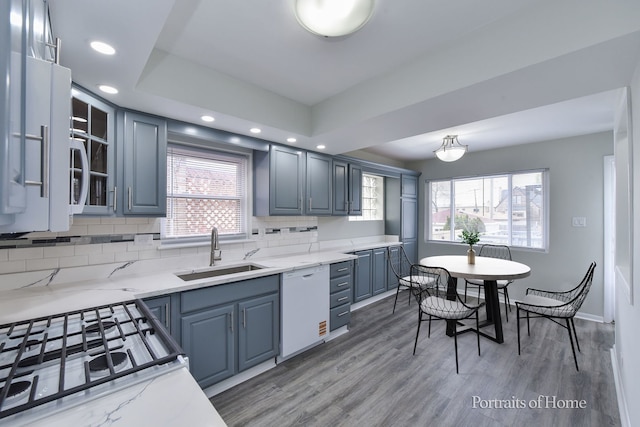 kitchen featuring a sink, a wealth of natural light, recessed lighting, and dishwasher