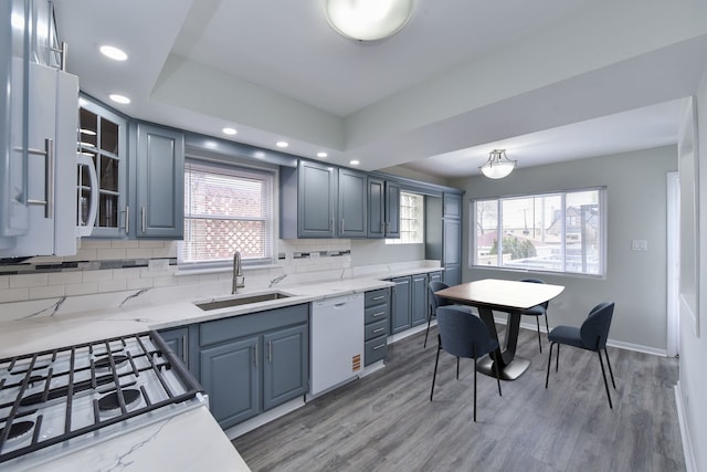 3834 Wisconsin Ave, Berwyn, IL 60402 - kitchen with a sink, white dishwasher, healthy amount of natural light, recessed lighting, and backsplash
