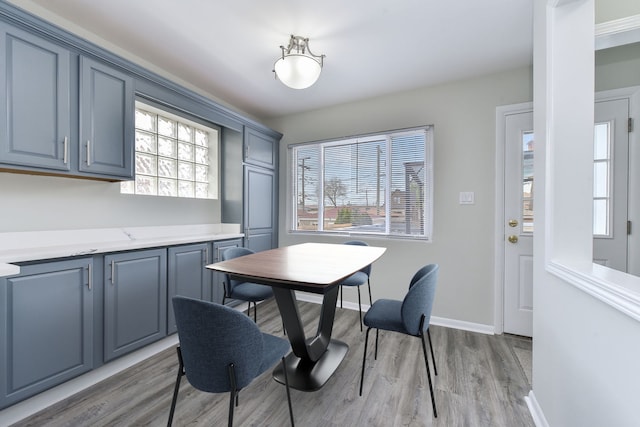 3834 Wisconsin Ave, Berwyn, IL 60402 - dining space with light wood-style flooring, healthy amount of natural light, and baseboards