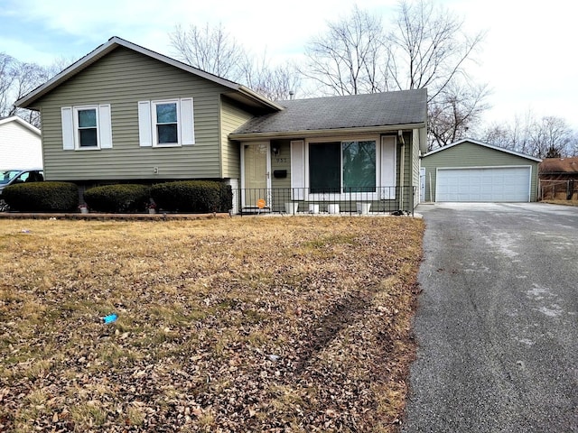 957 Harvard Ln, Matteson, IL 60443 - tri-level home featuring a shingled roof, an outbuilding, covered porch, and a detached garage