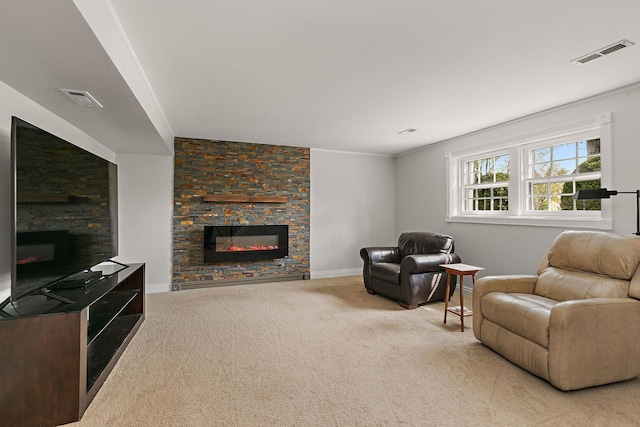 carpeted living area featuring baseboards, visible vents, and a fireplace