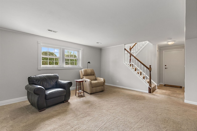 sitting room with baseboards, carpet, visible vents, and stairway