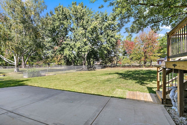 view of yard featuring a fenced backyard, a patio area, and a deck