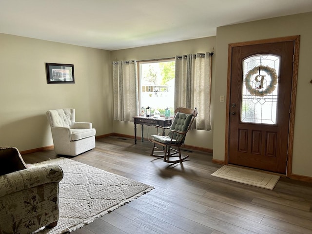 entrance foyer with baseboards and hardwood / wood-style flooring