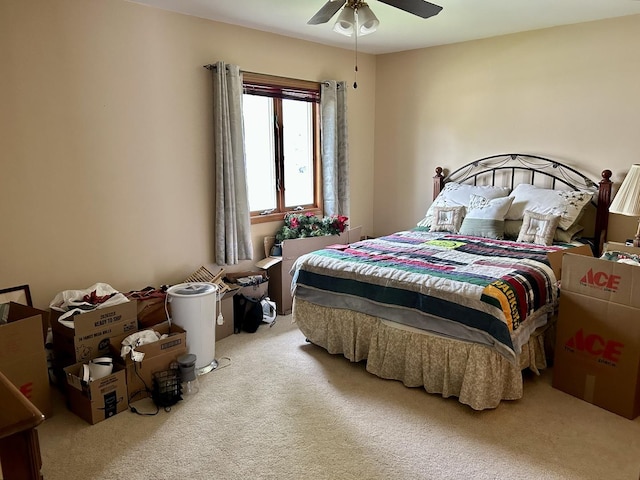 bedroom with a ceiling fan and carpet flooring