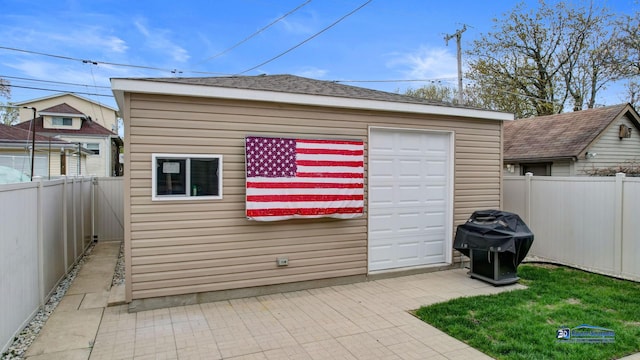 view of outbuilding featuring an outdoor structure and a fenced backyard
