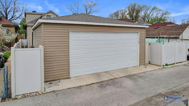 detached garage with fence