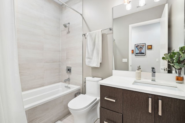 bathroom featuring washtub / shower combination, vanity, and toilet
