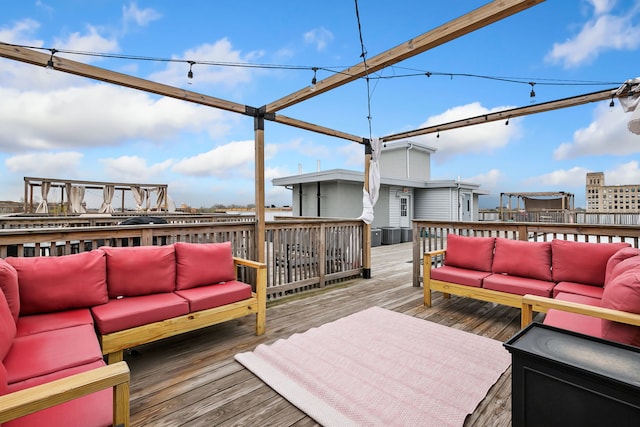 wooden terrace with outdoor lounge area