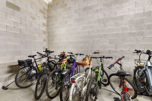 garage featuring bike storage and concrete block wall