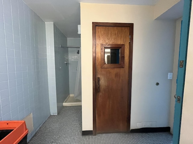 corridor with tile patterned flooring