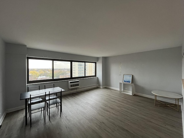dining space with baseboards and dark wood-style flooring