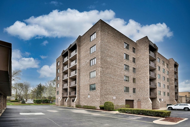 view of property featuring uncovered parking