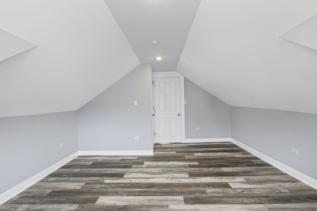 additional living space featuring baseboards, vaulted ceiling, recessed lighting, and wood finished floors