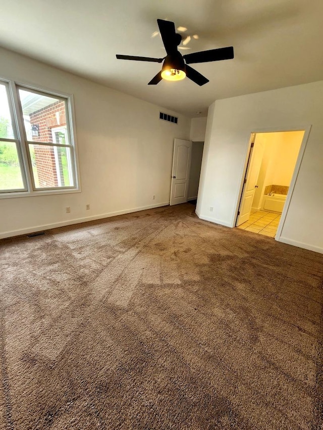 unfurnished bedroom featuring visible vents, baseboards, and light colored carpet