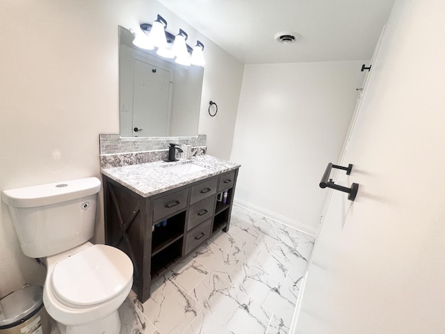 3240 N Manor Dr Unit 130, Lansing, IL 60438 - bathroom with vanity, toilet, marble finish floor, backsplash, and visible vents