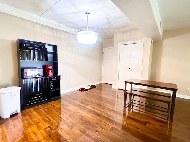 3240 N Manor Dr Unit 130, Lansing, IL 60438 - unfurnished dining area featuring baseboards and wood finished floors