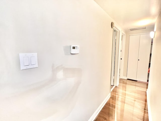 3240 N Manor Dr Unit 130, Lansing, IL 60438 - corridor with baseboards, visible vents, and light wood finished floors