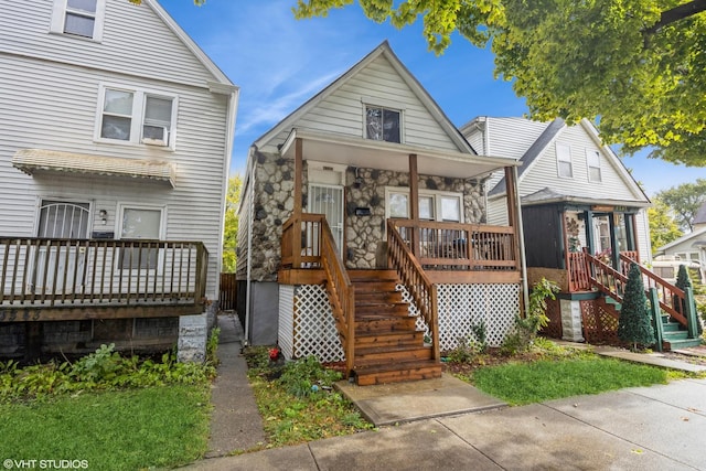 view of front of home with stairs and a porch