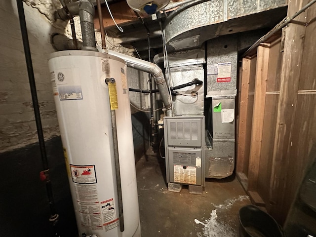 utility room featuring water heater