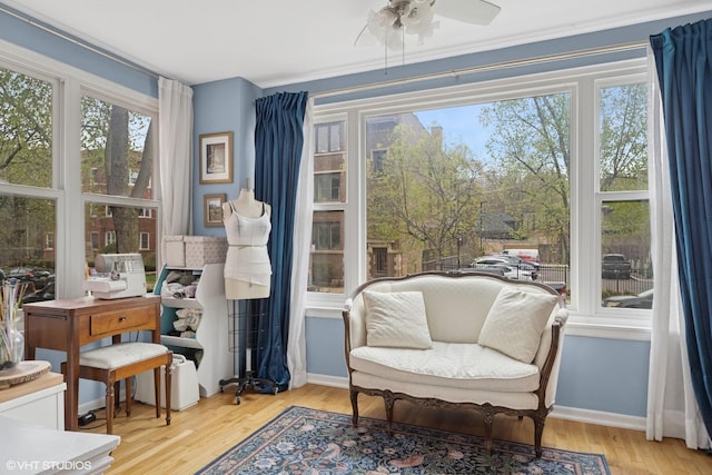 living room with crown molding, arched walkways, and wood finished floors
