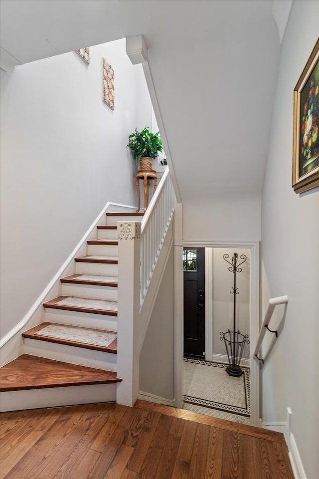 4336 N Troy St, Chicago, IL 60618 - staircase with baseboards and hardwood / wood-style floors