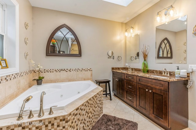 4336 N Troy St, Chicago, IL 60618 - bathroom featuring tile patterned flooring, a sink, a whirlpool tub, and double vanity