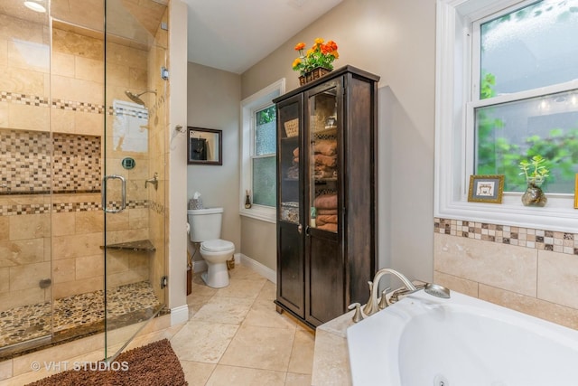 4336 N Troy St, Chicago, IL 60618 - full bath featuring toilet, tile patterned floors, a whirlpool tub, baseboards, and a stall shower
