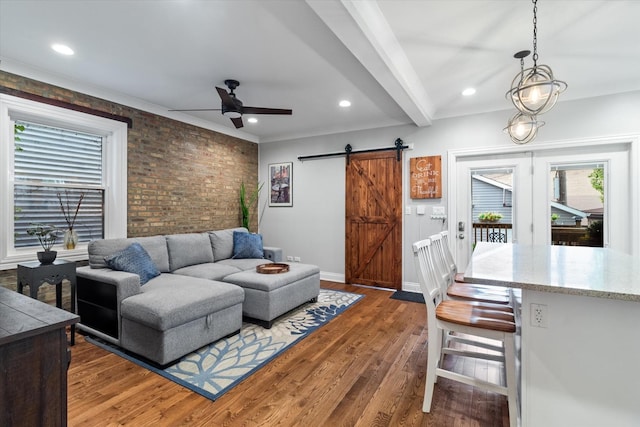 4336 N Troy St, Chicago, IL 60618 - living area with a barn door, brick wall, a ceiling fan, recessed lighting, and wood finished floors