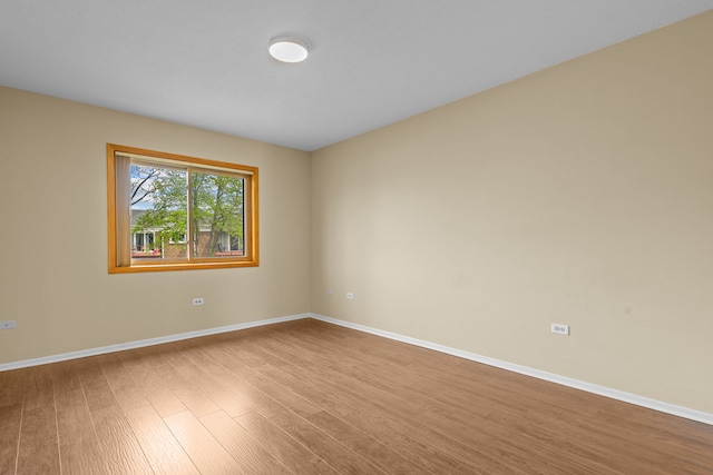 704 Cobblestone Cir Unit D, Glenview, IL 60025 - unfurnished room featuring baseboards and wood finished floors