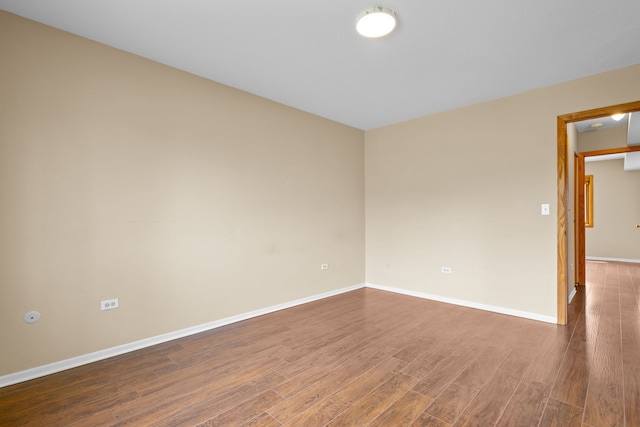 704 Cobblestone Cir Unit D, Glenview, IL 60025 - empty room featuring baseboards and wood finished floors
