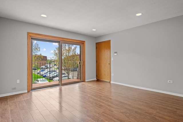 704 Cobblestone Cir Unit D, Glenview, IL 60025 - spare room featuring recessed lighting, baseboards, and wood finished floors