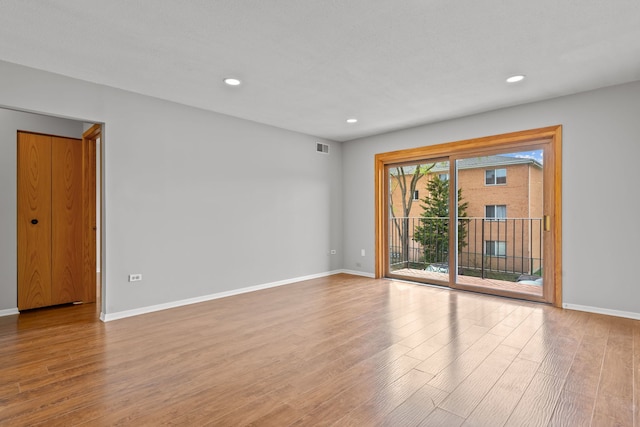 704 Cobblestone Cir Unit D, Glenview, IL 60025 - empty room with baseboards, wood finished floors, and visible vents