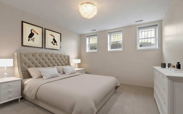 bedroom featuring baseboards, a notable chandelier, visible vents, and light carpet