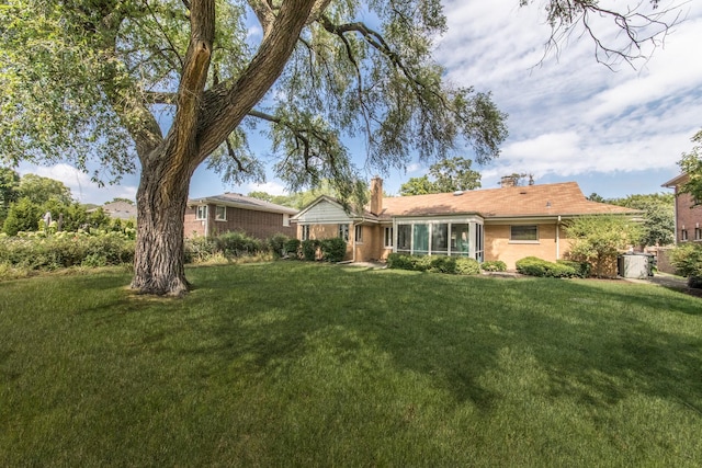 2001 Woodland Ave, Park Ridge, IL 60068 - single story home featuring a chimney, brick siding, and a front yard