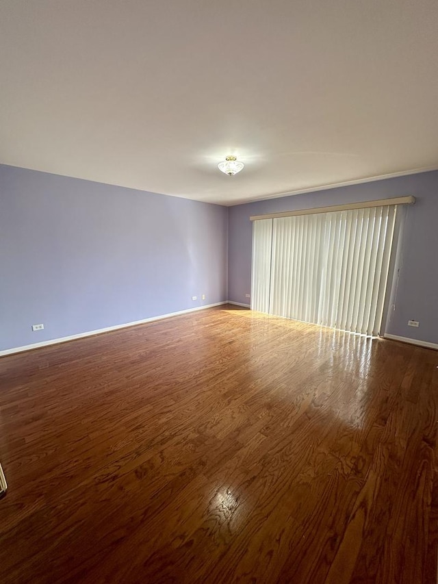 7091 W Touhy Ave Unit 509, Niles, IL 60714 - unfurnished room featuring wood finished floors and baseboards