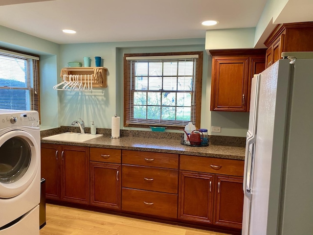 1994 Brentwood Ln, Wheaton, IL 60189 - clothes washing area featuring cabinet space, a sink, light wood-style floors, washer / clothes dryer, and recessed lighting