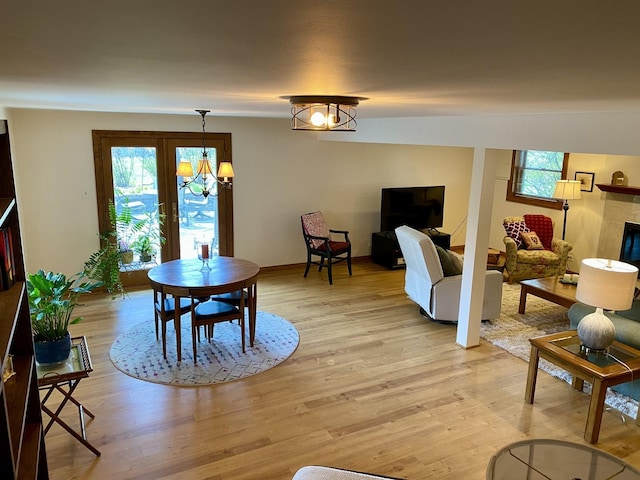 1994 Brentwood Ln, Wheaton, IL 60189 - dining space featuring plenty of natural light, light wood finished floors, and a chandelier